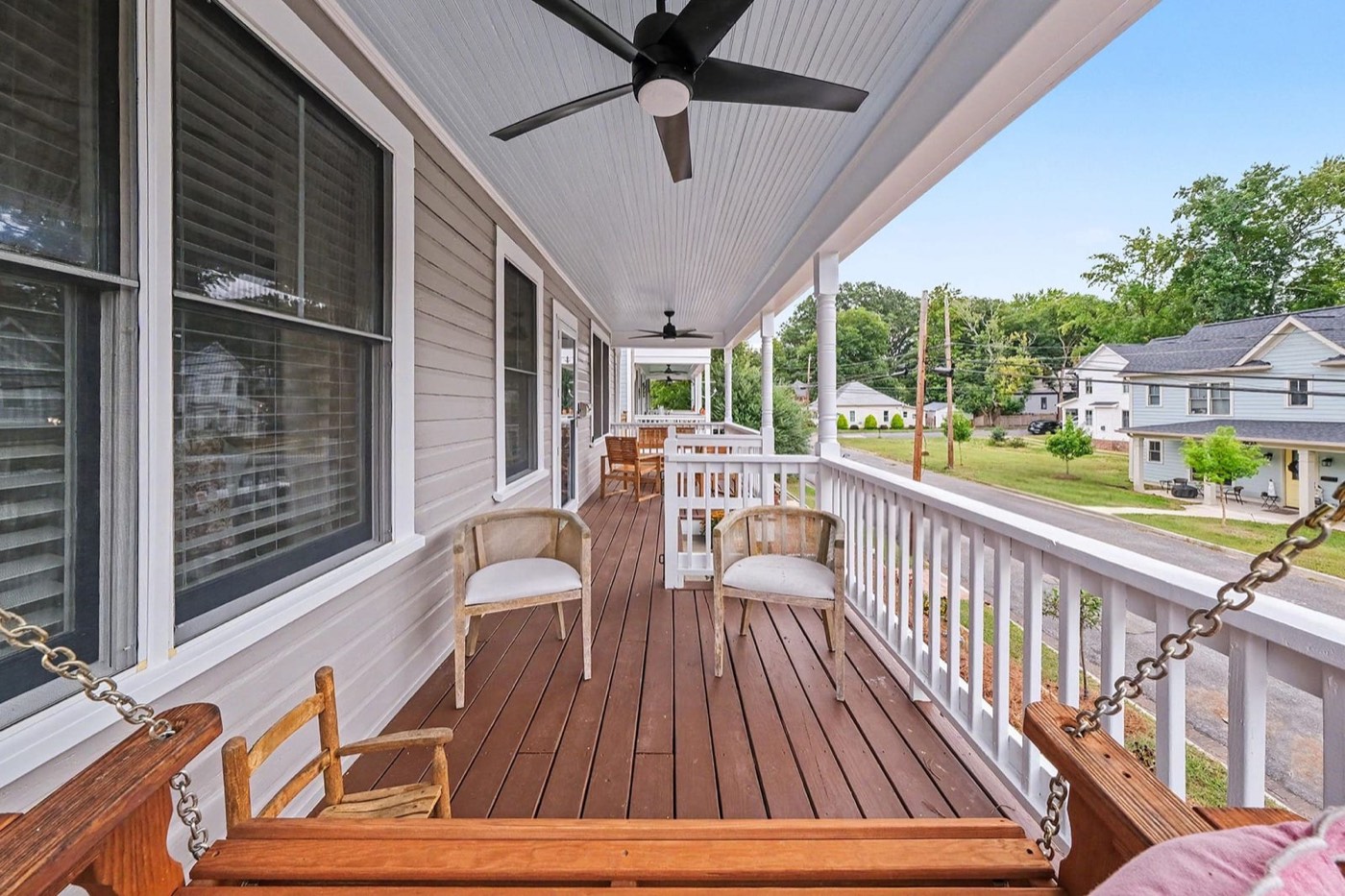 Covered front porch with a view toward the Durham skyline
