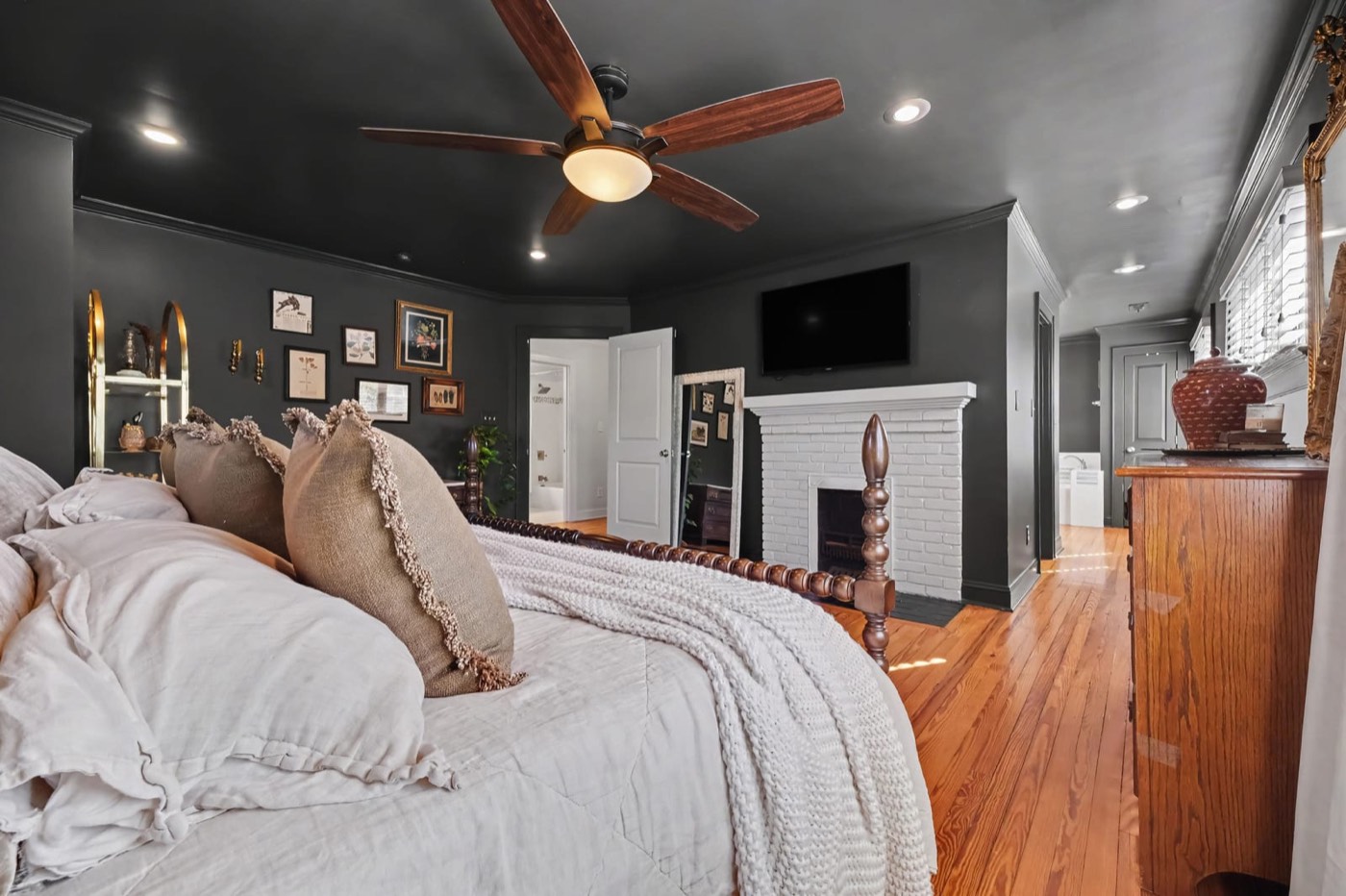 Primary suite with original fireplace and walk-in closet