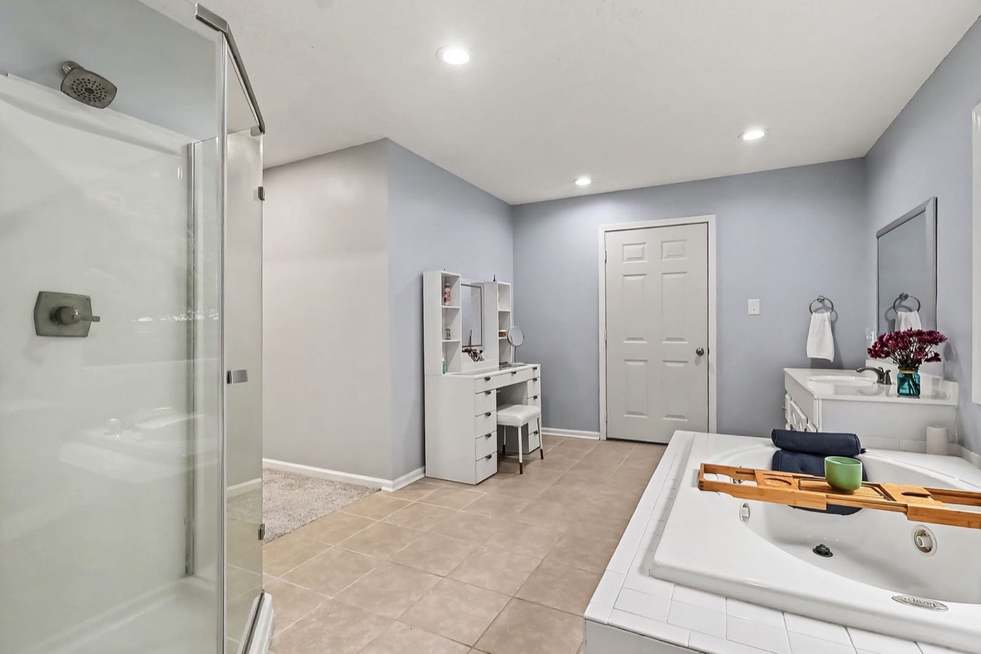 Primary bath with separate glass shower and soaking tub