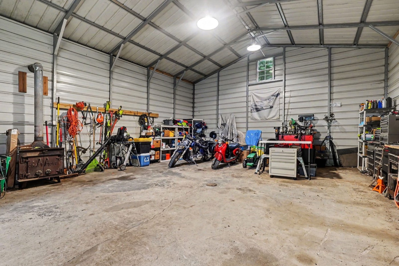 Inside the shop: soaring ceilings, workbench and storage