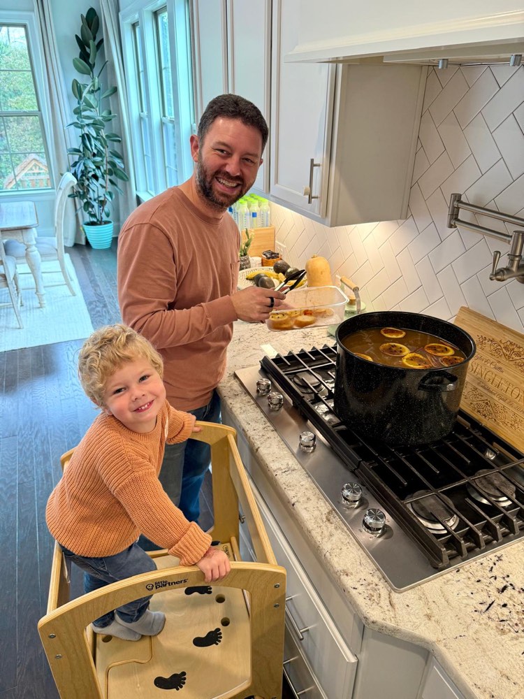 Making homemade hot apple cider in the kitchen