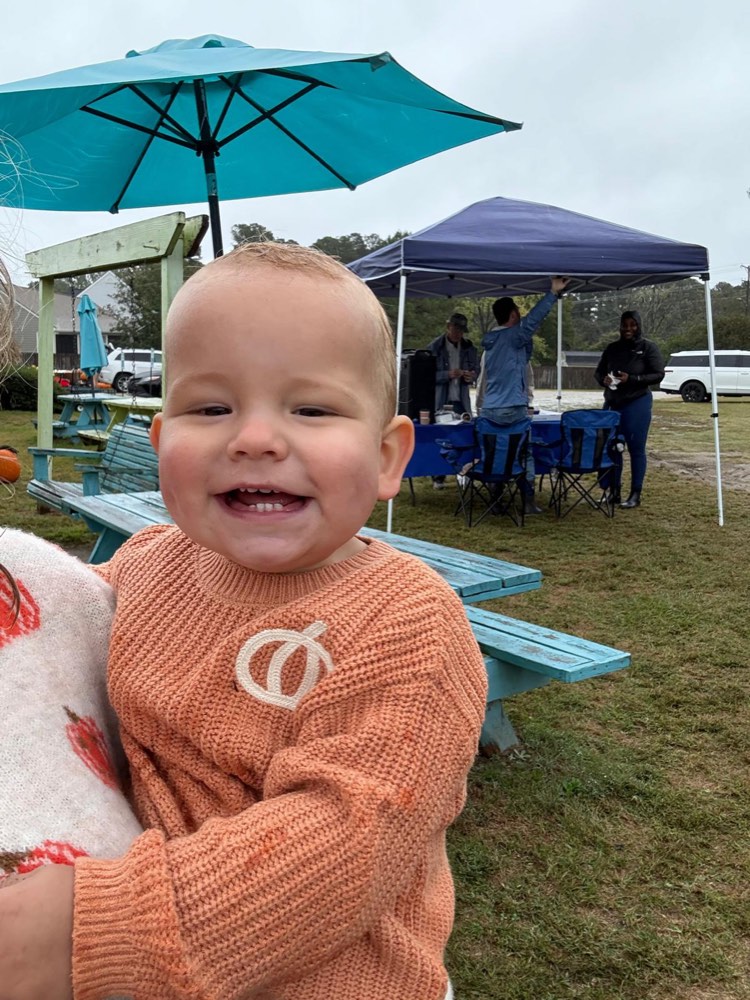 A very happy guest in a pumpkin sweater